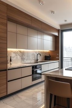 a modern kitchen with marble counter tops and wooden cabinetry, along with bar stools