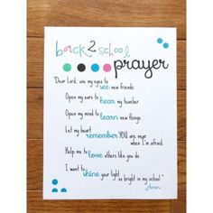 the back 2 school prayer card is on top of a wooden table