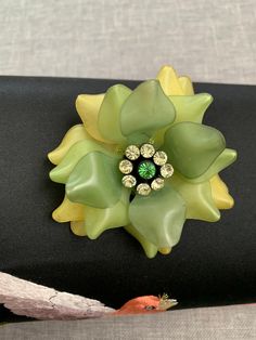 *Fabulous vintage piece *Elegant color and shape Cheap Green Flower Brooches, Elegant Color, Rhinestone Flower, Flower Brooch, Green Yellow, Brooch Pin, Brooches, Etsy Accessories, Bathing Beauties