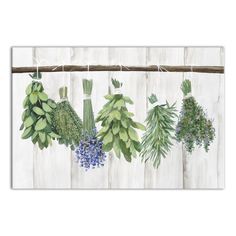 an art print of herbs hanging on a clothes line with blue flowers and green leaves