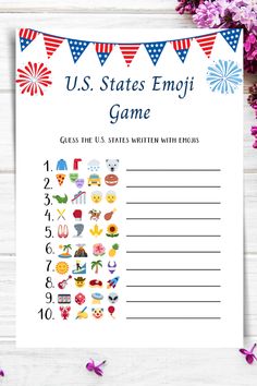 the us states emoj game is shown on a table with flowers and paper flags