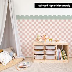 a child's room with pink checkered wallpaper and toys on the floor