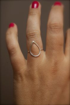 A simple, everyday ring, in an open teardrop design, handmade with sterling silver wire, hammered, with a matte finish. Teardrop's dimensions is 1.3 cm x 1.8 cm Please put the size into the Notes to Seller when you checkout. Thank you for looking. CANCELLATIONS, REFUNDS ETC: All items are sent made to the specifications you give me. Refunds cannot be given unless items are received broken or damaged etc.  Due to the custom nature of rings and any jewellery that is size specific, I cannot refund if you: - Change your mind - Have given me the wrong size and don't want to re-size - Bought as a gift & they don't like it - Not read the description properly THANK YOU. RING SIZES & RE-SIZING: For re-sizing, the cost of postage each way will be paid entirely by you. The re-sizing is free! Everyday Ring, Letter Ring, Sterling Silver Initial, Everyday Rings, Modern Ring, Silver Pieces, Rain Drops, Custom Necklace, Silver Wire