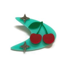 Retro Aqua Boomerang and Cherries Brooch - Levanter. 1950s style laser cut acrylic brooch. #retrobrooch #noveltybrooch #1950sbrooch #vintagestyle #retrostyle #rockabilly #pinup #quirkybrooch Pinup Accessories, Atomic 50s, Disney Heroes, Retro Stars, Stars Vintage, Acrylic Brooch, Acrylic Pins, Cherry Earrings, Glitter Acrylic