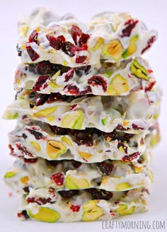 a stack of white chocolate barkies with cranberries and pistachio