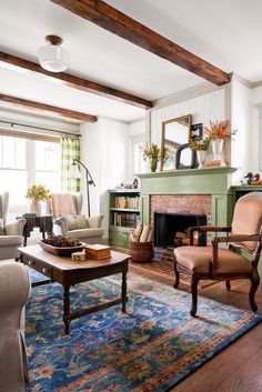 a living room filled with furniture and a fire place