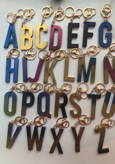 the letters and numbers are made out of different types of metal rings, chains, and hooks