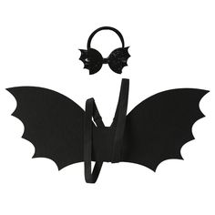 a black bat with wings and ears attached to it