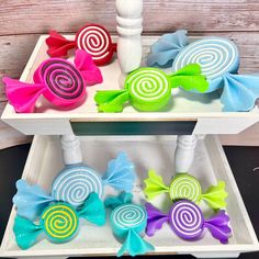 two white trays with colorful hair bows on them