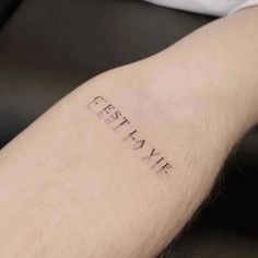 a person's arm with the word cestative written on it in cursive writing