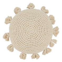 a round rug with tassels on it