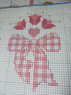 the cross stitch pattern is being worked on