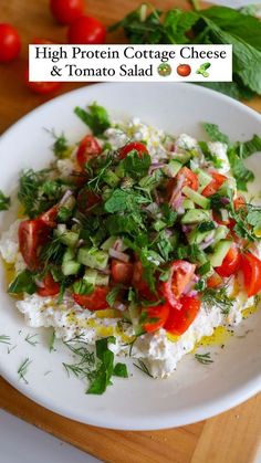 a white plate topped with rice and veggies on top of a wooden cutting board