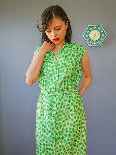 "DESCRIPTION * vintage dress from 1950s by Adele Martin * made with pure silk, in abstract green print * sheath dress style: form-fitting, a straight cut, and the waistline is slightly nipped, accentuating the long slim silhouette. * shirt collar, sleeveless * button down to the hip area * comes with matching belt * beige lining skirt * tag reads \"Adele Martin/ WPL 7588, 100% Pure Silk, Exclusive of Ornamentation, lining and trimming, Dry Clean Only/ Size 12/ Union Label ABFY 160866\" CONDITION 1950s Style Sleeveless Green Dress, Green Fitted Sleeveless Vintage Dress, 1950s Green Short-sleeved Dress, 1950s Style Green Vintage Dress For Spring, 1950s Style Green Short Sleeve Dress, 1950s Green Short Sleeve Dress, Green Vintage Style Dress For Summer, Green Vintage Dress For Summer, Green Summer Dresses For Vintage Fashion