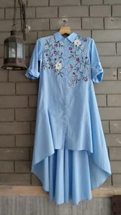 Beautiful asymetric Cotton Kurta with beautiful embroidery embellishments. Cotton Kurtas For Women Designer, Kurta Top Designs, Kurti Styles For Women, Different Kurta Designs For Women, Shirt Kurti Design, Embroidery Kurta Designs Women, Up Down Kurti Designs, Up And Down Kurti Design, Shirt Kurta Woman