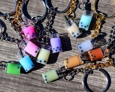 several dice shaped key chains with different colors