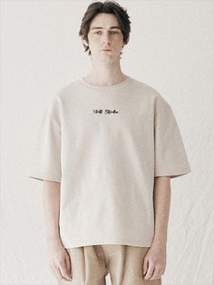 Editor's NoteFFEFF STUDIO's T-shirt is made with tenter processed and tumble washed fabric that shows high durability. With a clean and iconic cursive logo embroidery on the chest that shows FFEFF STUDIO's identity, it will stand out from your clean and casual daily outfit during spring and summer season. - Unisex sizing- Tenter processed fabric- Herringbone tape in the neckline- Graphic art print on the front- 3-line stitch on the sleeves and hem Measurements (in.)M/L/XL- Chest: 20.87 Basic Beige T-shirt For Streetwear, Beige Cotton T-shirt For Streetwear, Basic Beige Cotton T-shirt, Cotton T-shirt With Embroidered Text And Relaxed Fit, Cream T-shirt With Text Print For Streetwear, Cream Text Print T-shirt For Streetwear, Oversized Beige Cotton T-shirt, Beige Cotton Tops For Streetwear, Relaxed Fit Cotton Top With Embroidered Logo