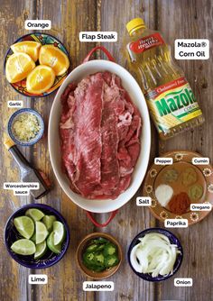 the ingredients to make mexican meat are shown in bowls on a wooden table, including limes, cilantro, jalapenos and mayo