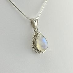 Sku 5379 Sterling Silver Rainbow Moonstone 10x19mm Teardrop Pendant 1 1/8"h x 1/2"w Moonstone is a birthstone for June, along with pearl and alexandrite. Moonstone has been used in jewelry since ancient civilizations. Romans and Greeks associated it with their lunar gods and goddesses. Romans believed that moonstone was formed from frozen moonlight. Legends say that moonstone brings good luck. Chain Sold Separately. Shown on a 18” Sterling Silver Snake Chain for $39.50. Moonstone Necklace Silver, Rainbow Moonstone Jewelry, Rainbow Moonstone Necklace, Shimmer Shine, Silver Snake Chain, Teardrop Pendant, Moonstone Necklace, Moonstone Jewelry, Ancient Civilizations