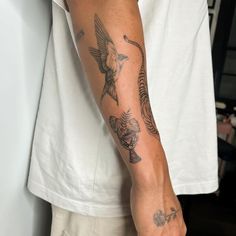 a man with a tattoo on his arm