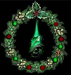 a green christmas wreath with holly and red berries on it's side, in the shape of a bat