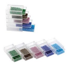 plastic storage containers with various beads in them