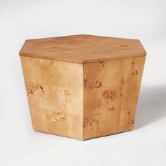 a small wooden box sitting on top of a white surface