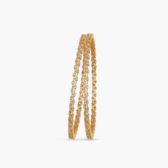 Description: This stackable bangle features glistening round CZ stones that grace the wrist with an aura of light. Just slip them on casuals for everyday fashion. Details & Specifications: Materials used: CZ stones with Yellow and White Gold Plating Weight - 32 gm Length - 2.6- 2.375 cm, 2.8- 2.5 cm Make it custom Want to make it a custom bangle? Sure! Reach out to us at support@tarinika.com and we’ll be happy to make possible modifications at no extra cost. Feel free to write to us on the same Cz Bangles, Custom Bangle, Stackable Bangles, Gold Polish, Cz Stone, Fashion Details, Jewelry Trends, Gold Plating, Indian Jewelry