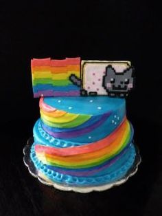 a cake decorated to look like a rainbow cat