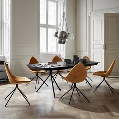 a dining room table with four chairs around it