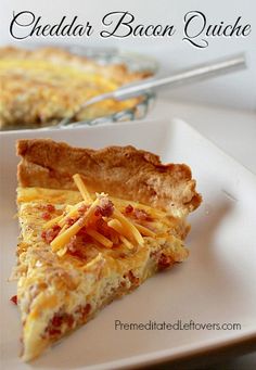 a slice of cheesy bacon quiche on a white plate