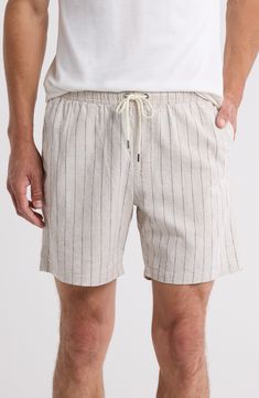 Lightweight cotton woven in pale stripes invites sunny-day comfort in shorts that tie at the waist and offer roomy pockets for holding essentials. 6" inseam; 22" leg opening; 11" front rise; 15" back rise (size Small) Elastic/drawstring waist Side-seam pockets; back flap-patch pocket 52% linen, 46% cotton, 2% elastane Machine wash, tumble dry Imported Striped Beach Bottoms With Drawstring, Striped Drawstring Bottoms For Beach, Striped Cotton Beachwear Bottoms, Striped Relaxed Fit Linen Bottoms, Striped Linen Bottoms Relaxed Fit, Cotton Relaxed Fit Shorts With Vertical Stripes, Striped Bottoms With Pockets For Beach Season, Vertical Stripes Short Bottoms For Beach, Striped Summer Shorts With Elastic Waistband