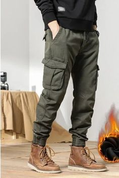 Introducing our newest addition to our men's clothing collection - the 2022 Multi-Pockets Winter Cargo Pants! These pants are perfect for those looking for a combination of style and functionality. With its slim fit design, it is sure to accentuate your figure whilst providing ample warmth during the winter season. Featuring multiple pockets, you can now carry all your essentials without compromising on style. Made of high-quality fleece fabric, these pants will keep you warm and cozy, making it perfect for outdoor activities. Available in black, it will easily match with any outfit, making it a versatile addition to your wardrobe. Get yours now and elevate your winter wardrobe game. Cargo Pants Matching Outfit, Mens Clothing Styles Cargo Pants, Winter Pants For Men, Cargo Pants Outfit Men Winter, Men’s Cargo Pants Styles, Pants Men Aesthetic, Men’s Pants, High Waisted Pants Casual, Cargo Pants Men Outfit