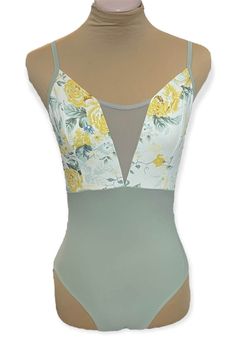 a female mannequin wearing a bodysuit with flowers on the front and sides