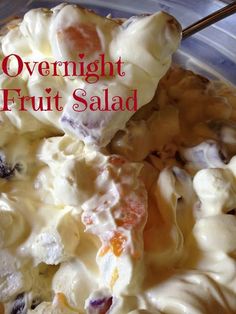 a close up of food in a bowl with the words overnight fruit salad on it