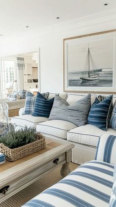 a living room with blue and white striped furniture