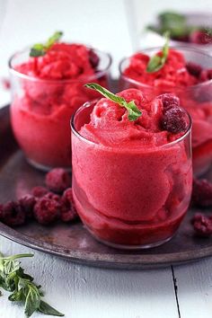 raspberry mousse in small glasses on a plate