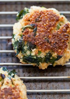 crab cakes with spinach and cheese are cooling on the grill