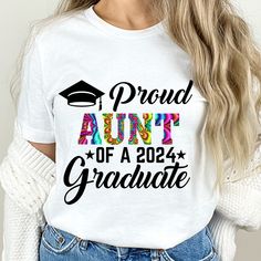 a woman wearing a white shirt with the words proud to be an adult graduate on it