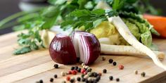 some vegetables are sitting on a cutting board