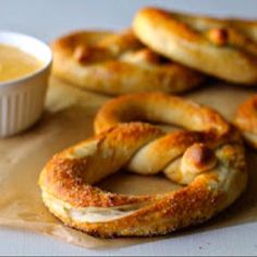 pretzels and dip are sitting on a table