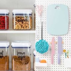 kitchen storage containers with labels on them and spoons next to the jars that are labeled