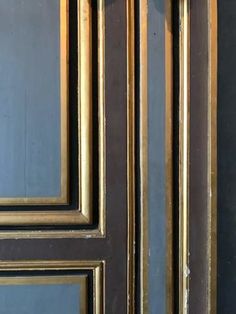 a close up of a door with gold trim