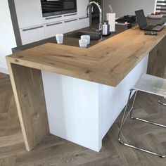 a modern kitchen with an island counter top