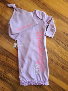 This personalized baby gown is the perfect coming home outfit, baby name announcement or baby gift. I use AJ Blanks or ARB Blanks which are boutique quality gowns and hats. They are a one size fits all gown (0-3 Months). They are super soft and have a hidden zipper along the side for easy dressing and diaper changes. These are 100% Customizable! In the pictures you will see the color options for the gowns and leave a note with the colors you want for each name. Glitter or Plain HTV. If no color Cute Onesie With Name Print As A Gift, Baby Gown With Name, Peanut Butter Baby, Newborn Onesie With Name, Cotton Onesie With Name Print, Baby Name Announcement, Newborn Gown, Going Home Outfit, Baby Gown