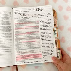 a person holding an open bible in their hand with the word truth printed on it