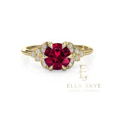 a ring with a red stone surrounded by diamonds