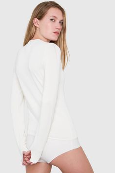 Because of the polished, never-out-of-place look, bodysuits are here to stay. We designed ours to be comfortable and absolutely seamless when worn with body-hugging pants or skirts. The upper part is sweater knit made of luxurious viscose yarn from one of the most renown mills in Italy. The material is biodegradable, and ours is certified by the Forest Stewardship Council to come from renewable resources. The panty portion is made of an anti-wicking jersey that prevents sweating and has laser-cu Sweater Bodysuit, Basics Wardrobe, Panty Style, Slim Fit Sweater, Boy Cuts, Elastane Fabric, Sustainable Brand, Wardrobe Basics, Sweater Knit