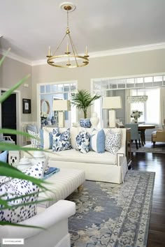 the living room is decorated in blue and white