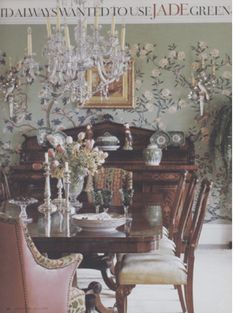 a dining room table with chairs and a chandelier